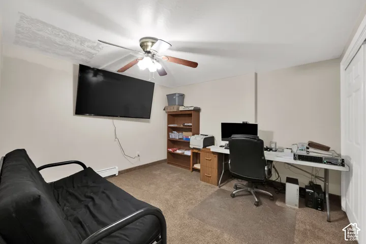Room with neutral wall paint, carpeted flooring, and a ceiling fan with integrated lighting