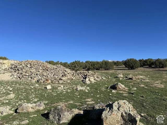 Expansive acreage featuring natural rock outcroppings, native vegetation, and mature juniper trees