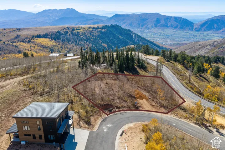 Elevated hillside lot featuring expansive mountain scenery and paved road access