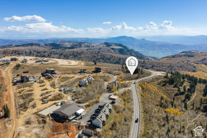 Elevated homesite with panoramic mountain surroundings and direct paved road access