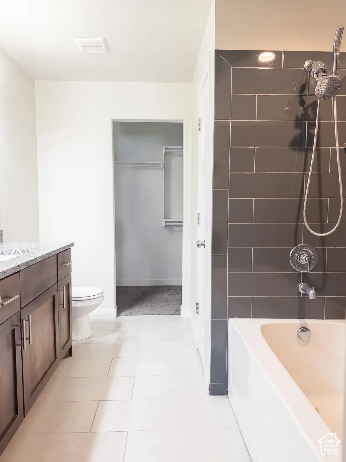 Primary bathroom with walkthrough closet