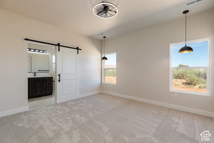 Recessed lighting, ceiling fan, and two windows