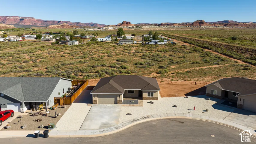 Single-story residence featuring a concrete driveway and an attached two-car garage