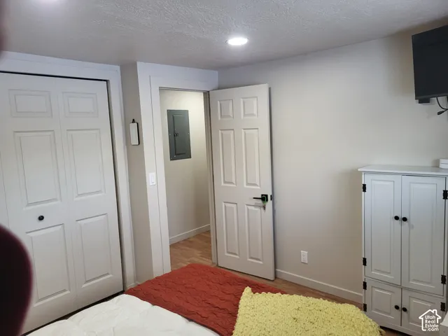Interior space featuring recessed lighting, multi-panel doors, and wood-finish flooring