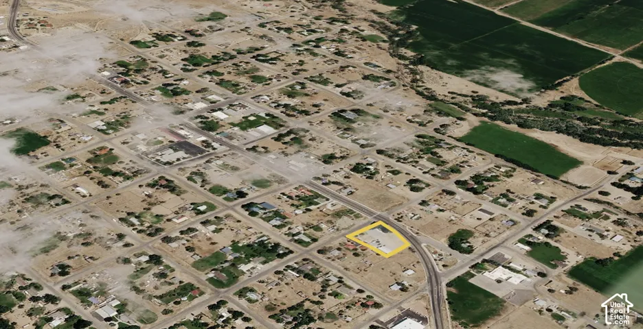 Corner lot situated within a platted grid with street access and proximity to agricultural acreage