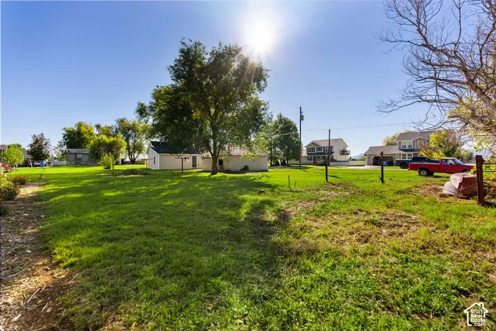 Expansive lot featuring mature trees and established lawn area