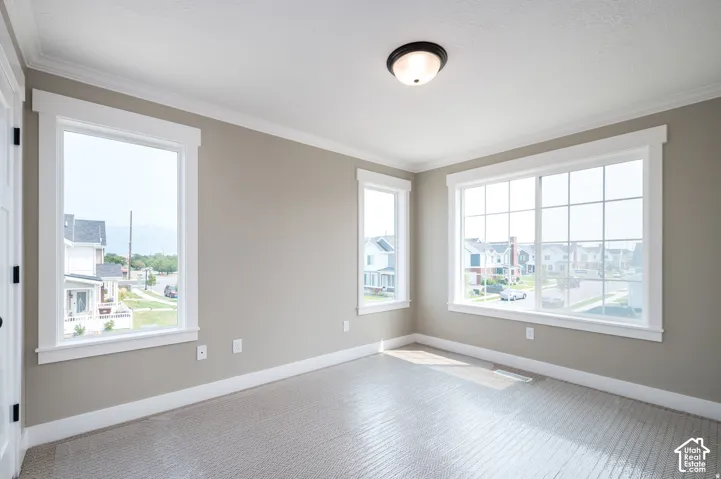 Room featuring neutral wall tones and light-colored carpeting