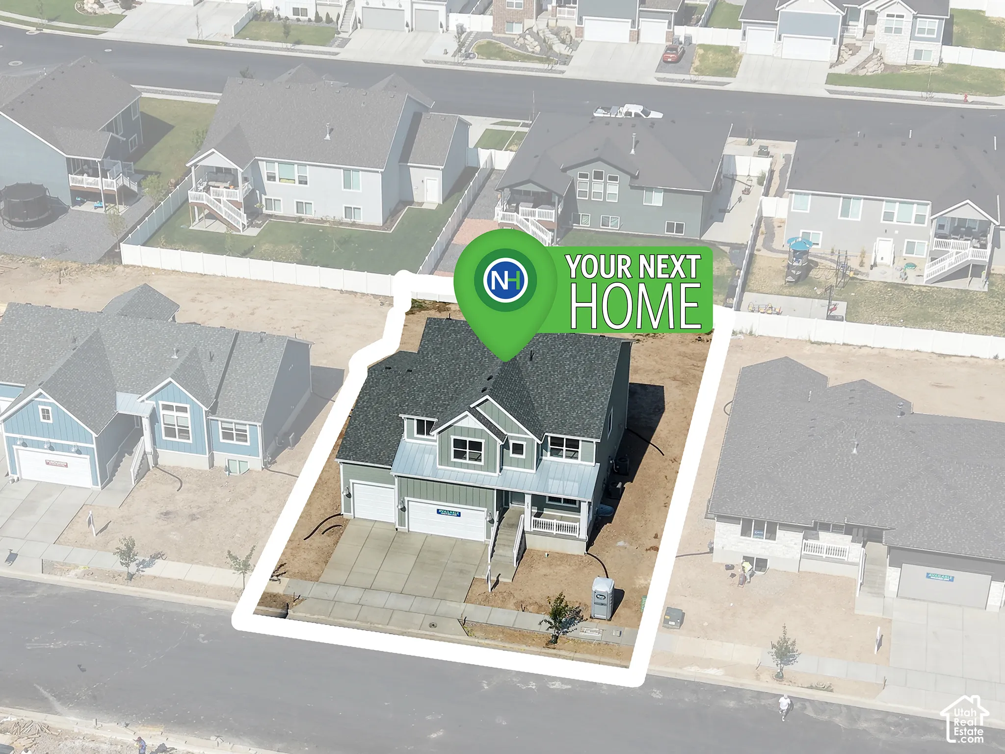 Two-story residential structure with a shingled roof, attached multi-car garage, concrete driveway, and covered front entryway