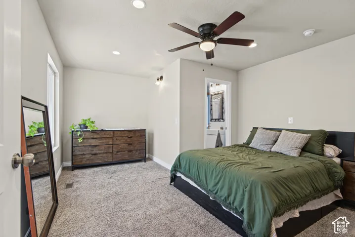 Neutral-toned interior featuring recessed lighting, a multi-blade ceiling fan, and wall-to-wall carpeting