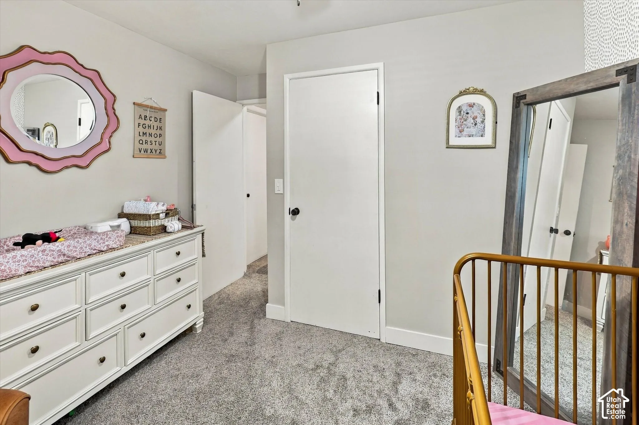 Interior space featuring neutral wall paint, wall-to-wall carpeting, and solid-core interior doors with dark hardware