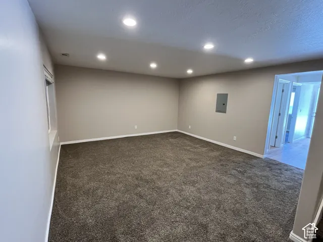 Spacious interior featuring recessed lighting, neutral wall paint, and wall-to-wall carpeting