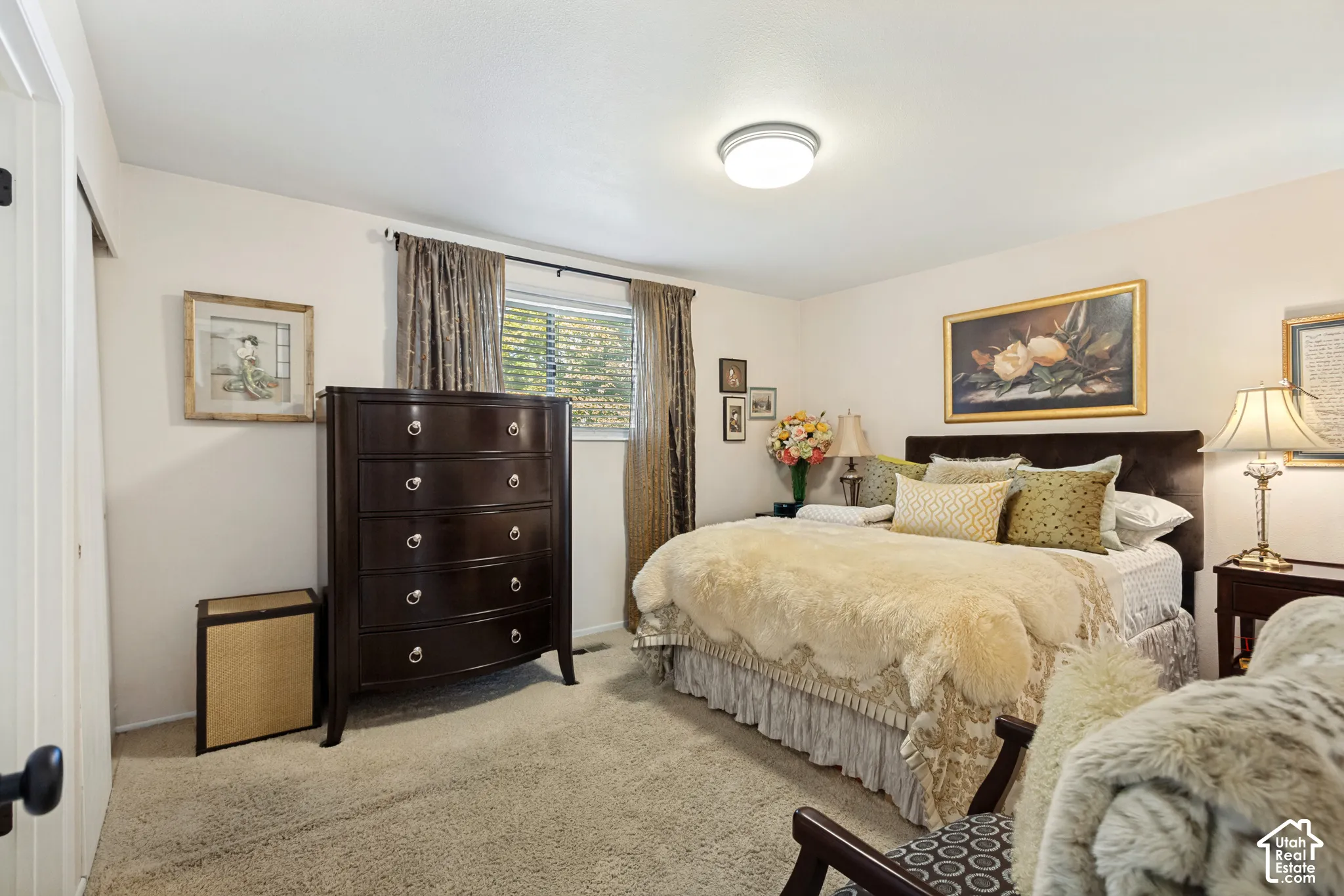 Neutral wall palette with wall-to-wall carpeting, single-pane window, flush-mount ceiling light fixture, and closet with sliding doors