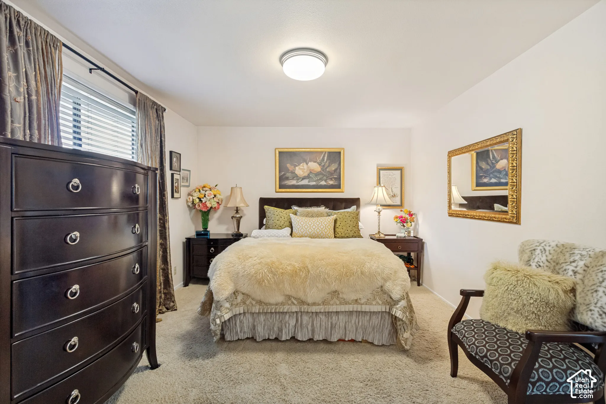 Neutral wall color, wall-to-wall carpeting, window with horizontal blinds, and flush-mount ceiling lighting