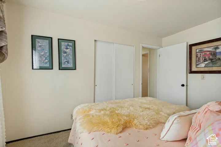Neutral-toned walls, dual-panel sliding closet doors, and solid-core interior doors