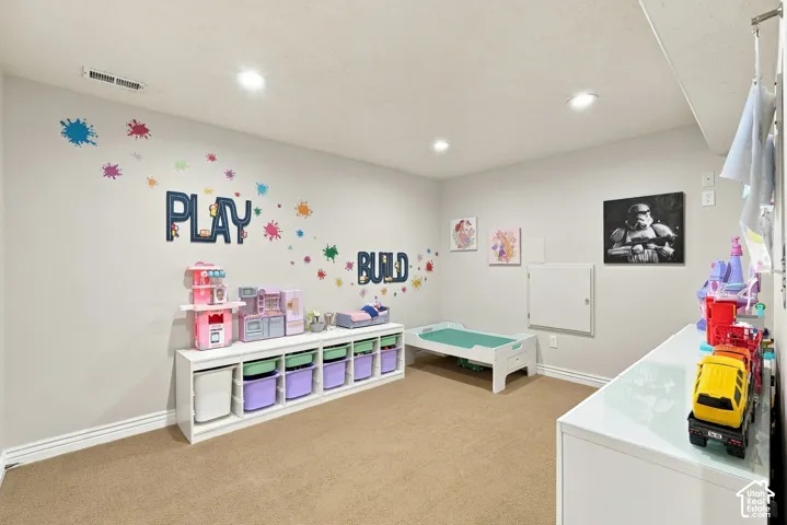 Interior room featuring neutral wall paint, recessed lighting, and wall-to-wall carpeting