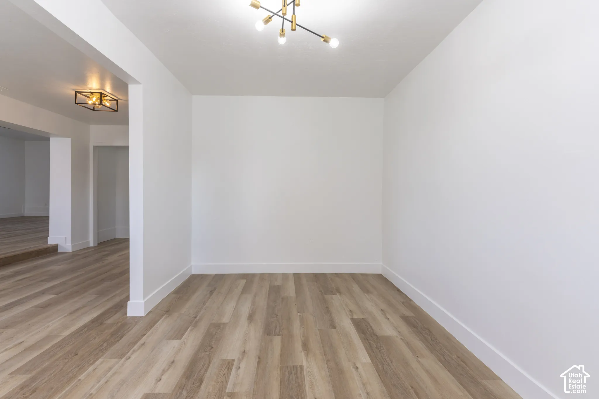 Main floor office/living room with new LVP and lighting.