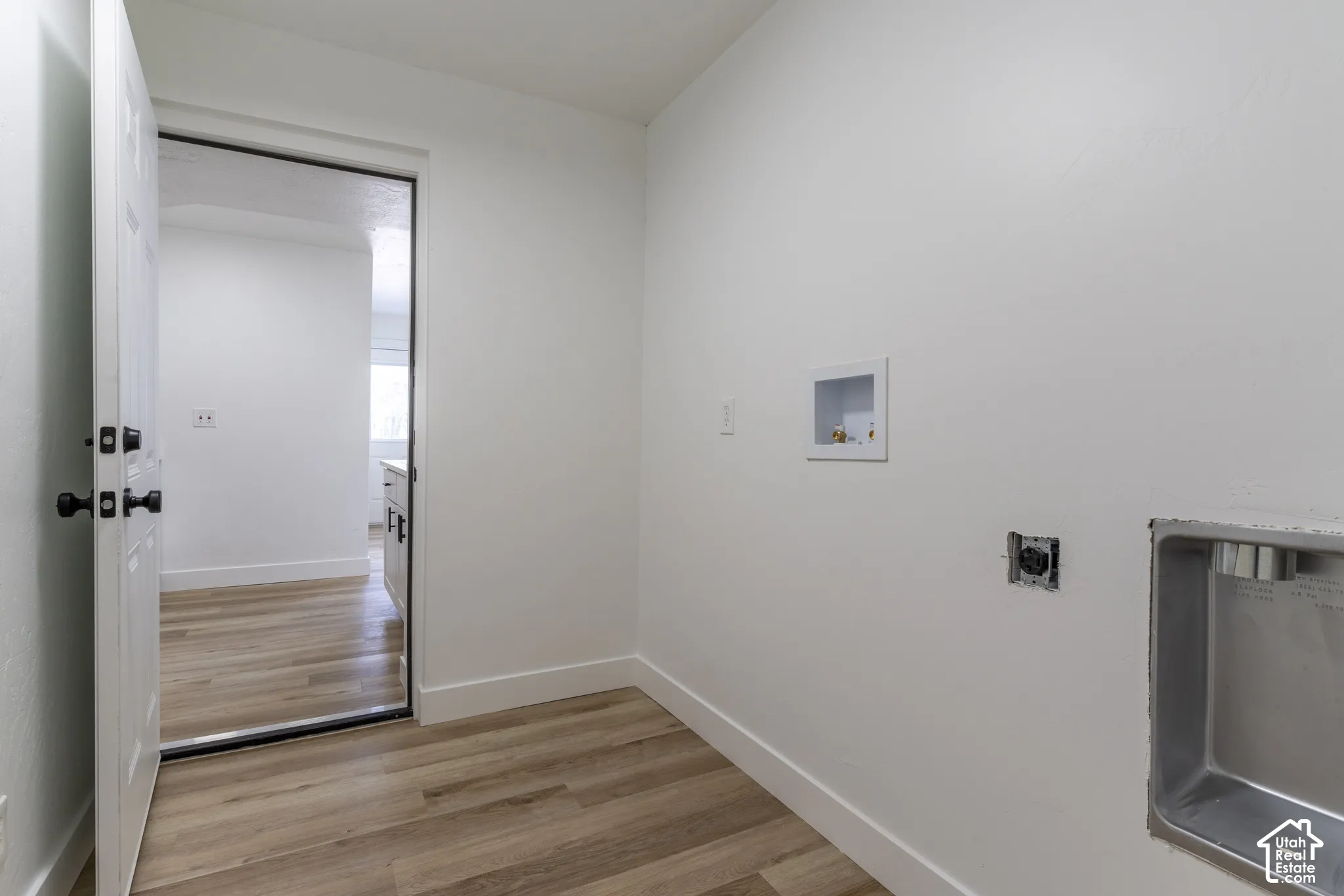 Main floor laundry room with shared access to ADU
