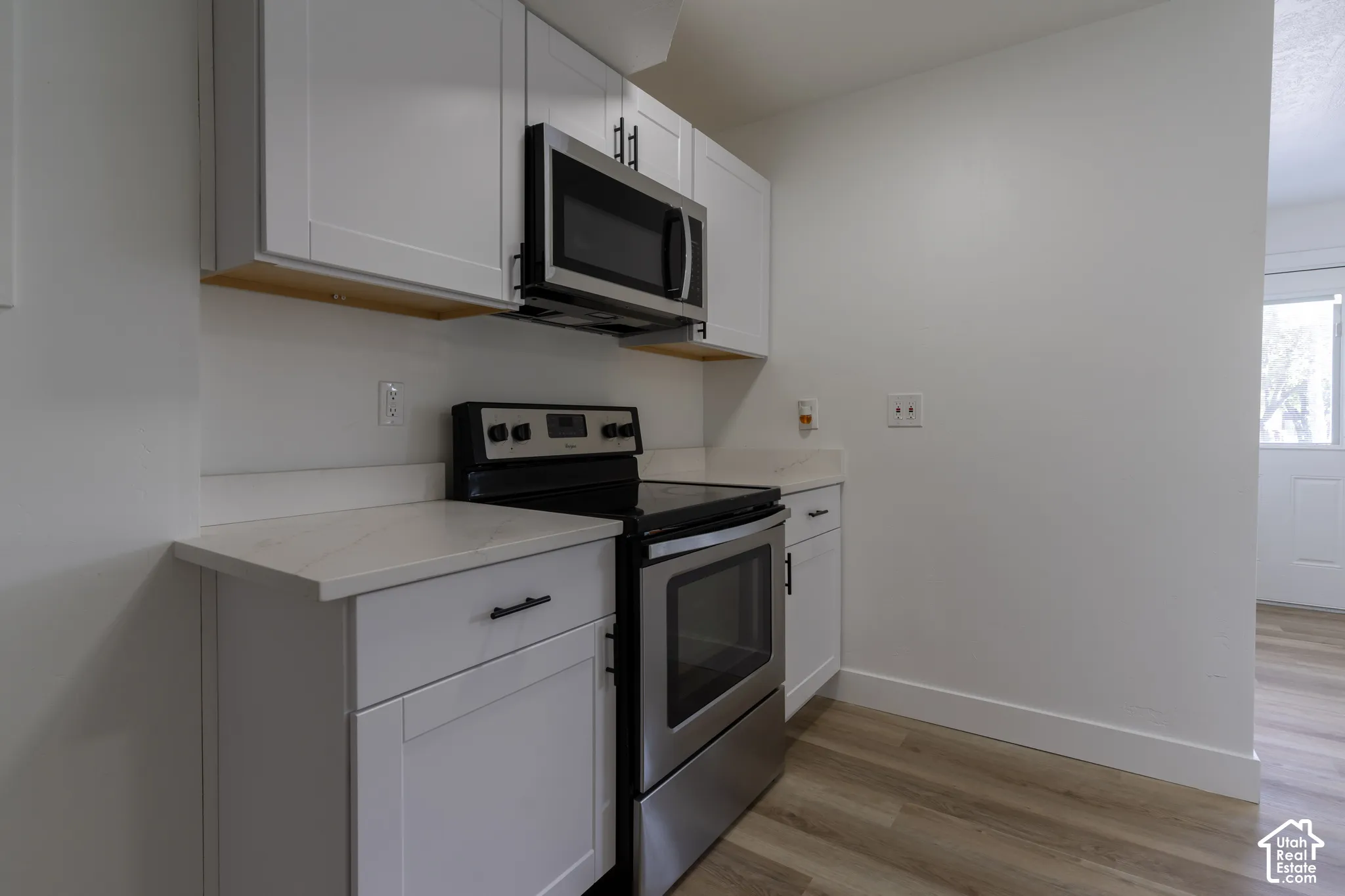 ADU kitchen with new cabinetry, quartz countertops, and stainless-steel appliances