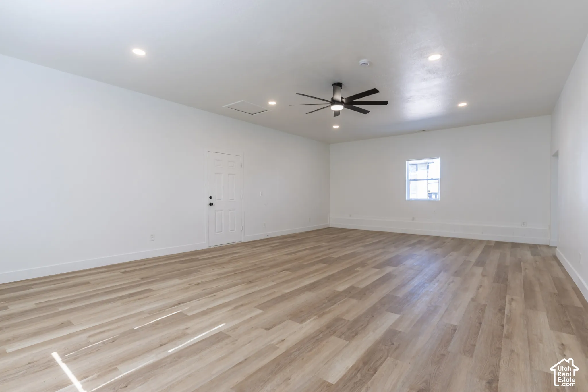 Massive main floor family room with new LVP flooring and lighting.