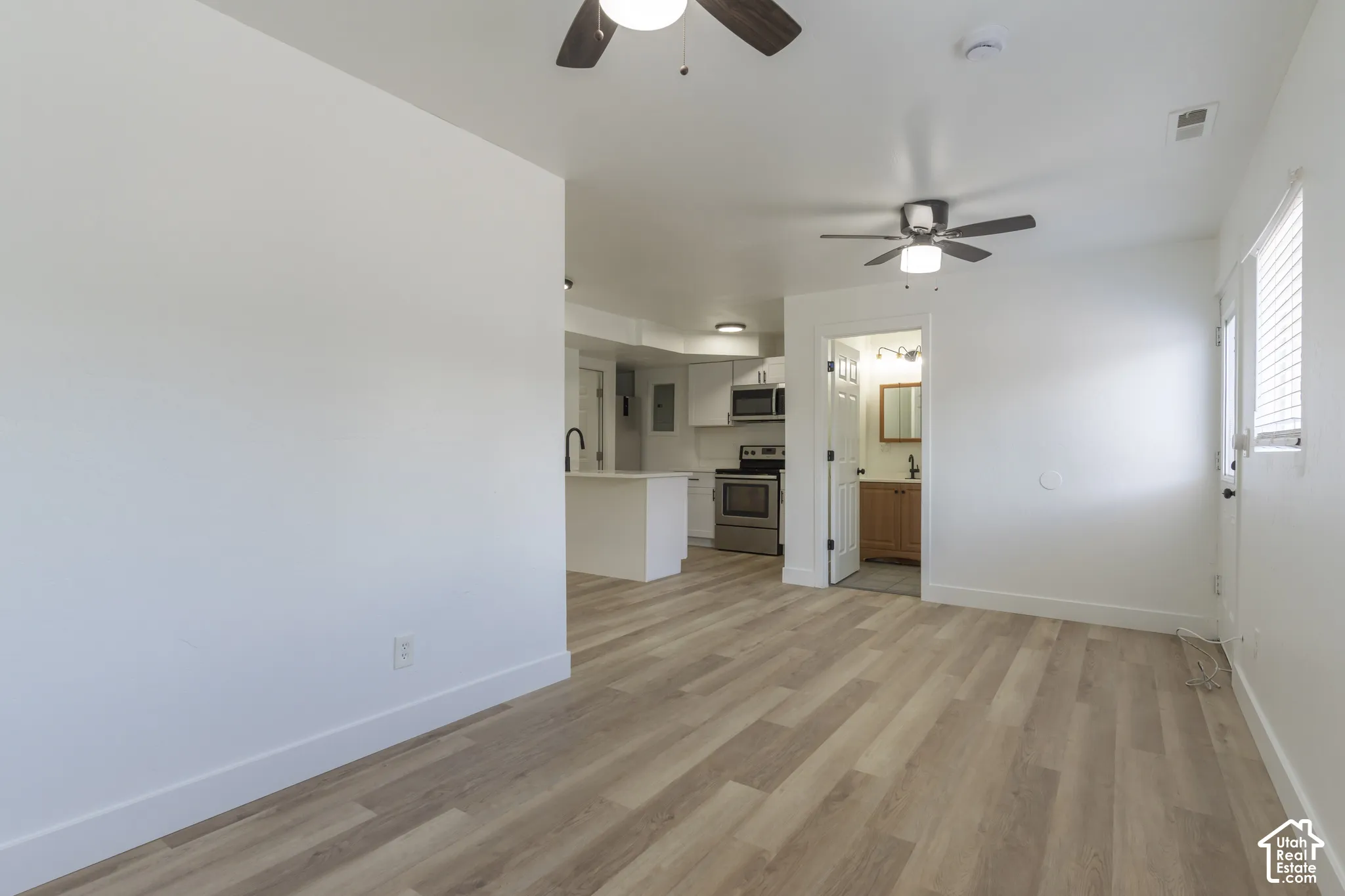 ADU living room with new LVP and lighting