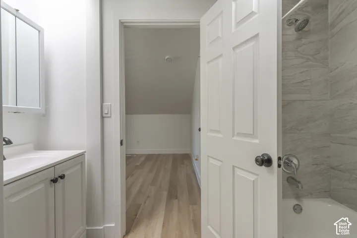 Primary bathroom with all new flooring, cabinetry, and fixtures.