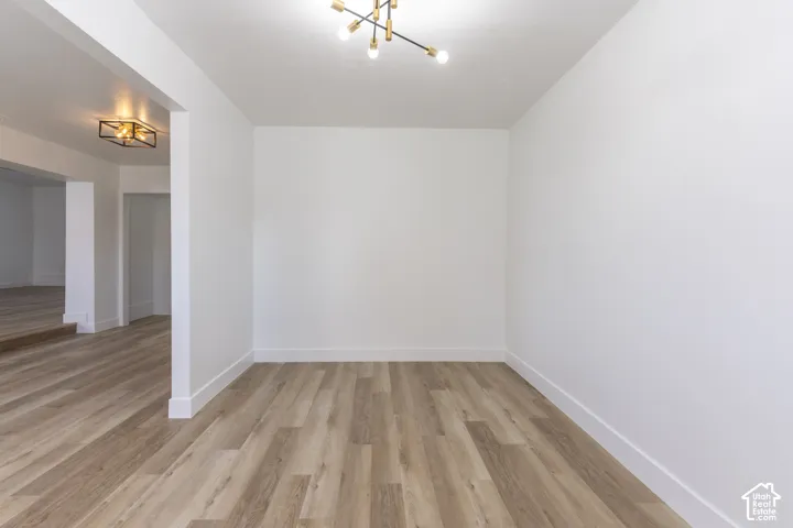 Main floor office/living room with new LVP and lighting.