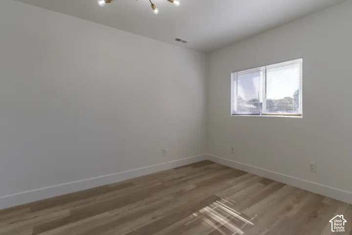 Main floor office/living room with new LVP and lighting.