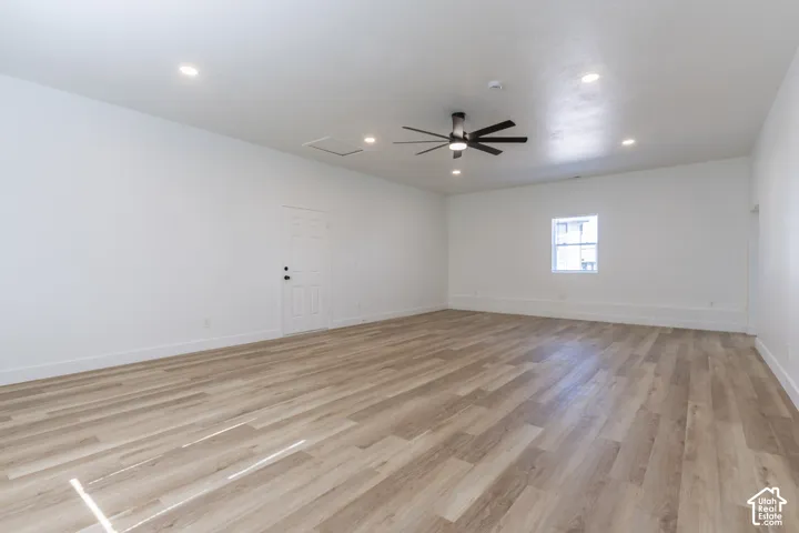 Massive main floor family room with new LVP flooring and lighting.