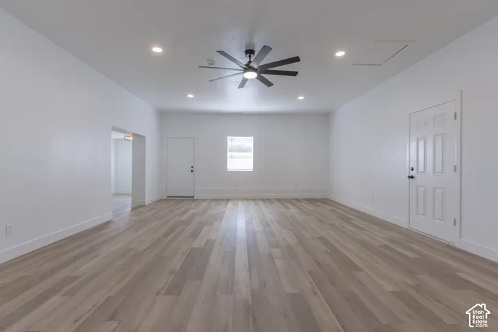 Massive main floor family room with new LVP flooring and lighting.