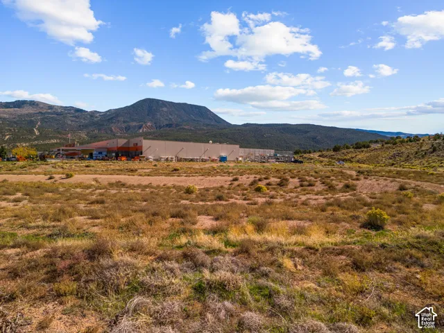 Expansive unimproved acreage featuring natural desert terrain and mountain backdrops