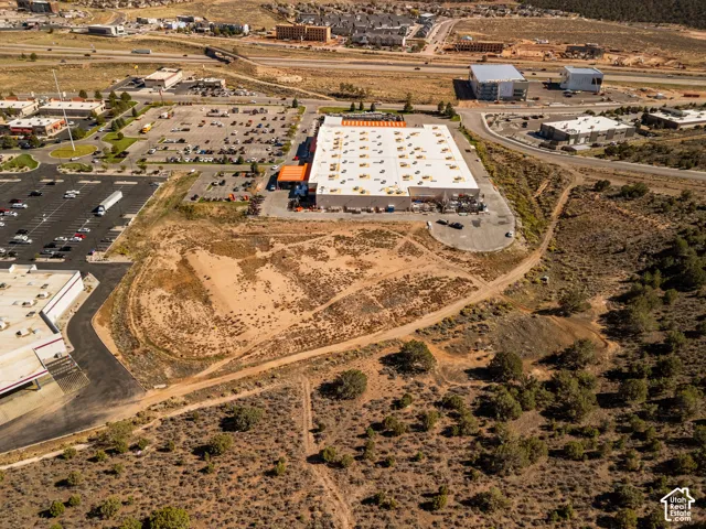 Undeveloped lot featuring native terrain and proximity to established commercial infrastructure and major roadway access