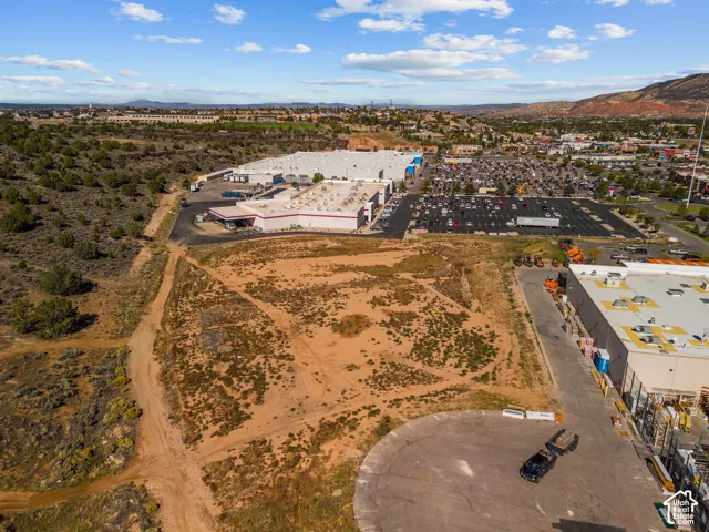 Undeveloped land parcel featuring natural terrain and mountain backdrop