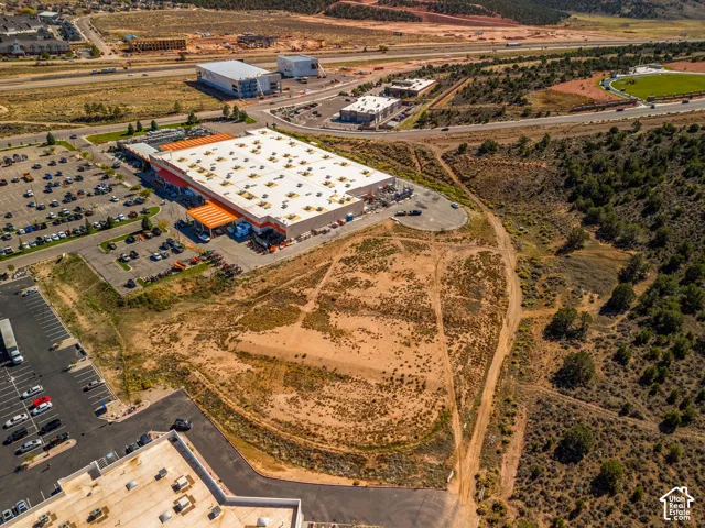 Expansive undeveloped acreage with natural terrain, significant frontage, and proximity to regional transportation routes and established commercial infrastructure