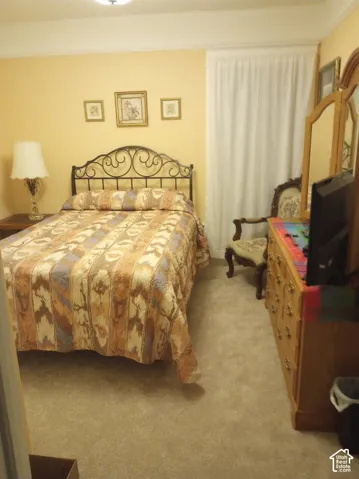 Room featuring wall-to-wall carpeting and neutral-toned wall paint