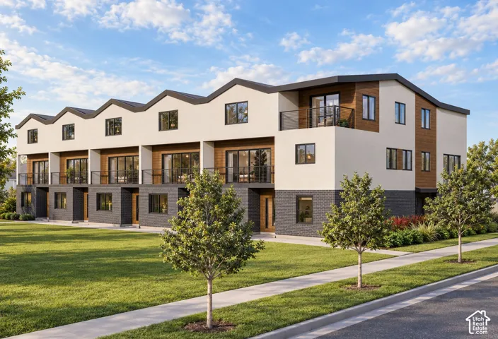 Multi-unit residential exterior featuring a mixed-material facade of dark brick and light stucco with wood-tone siding accents, tiered rooflines, and metal balcony railings