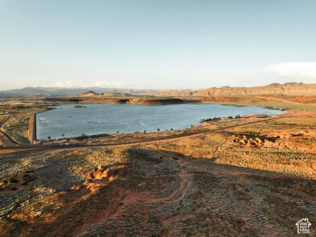 Aerial landscape featuring desert terrain, natural rock formations, and proximity to an expansive reservoir