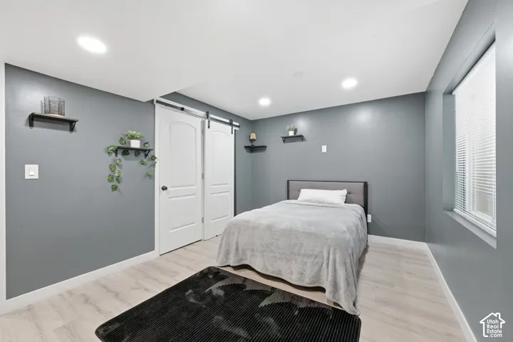 Recessed lighting illuminating light wood-finish flooring