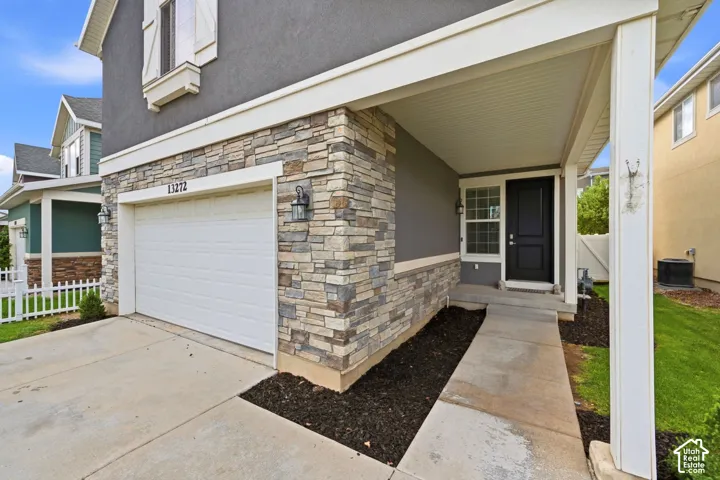 Multi-textured exterior featuring stone accents and stucco