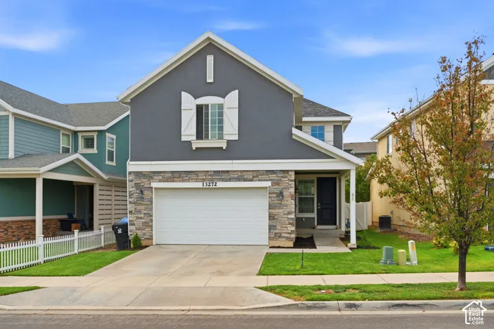 Stucco and stone facade with a two-car garage