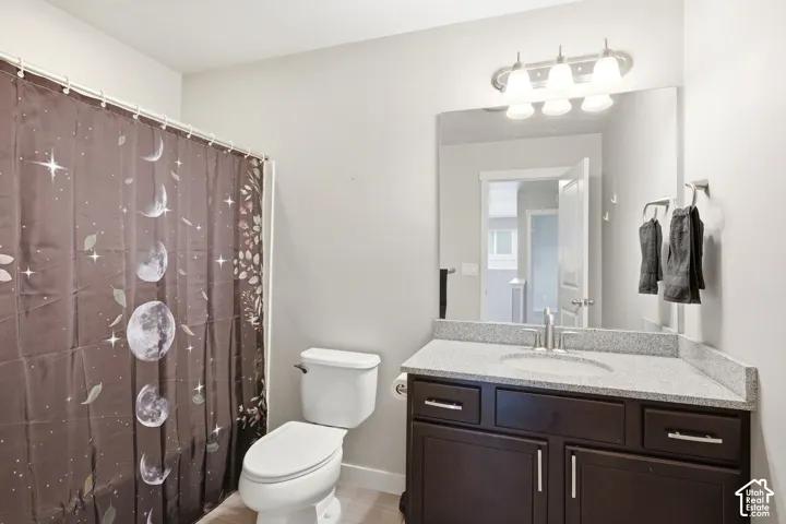 Vanity with a light-colored countertop and under-mount sink