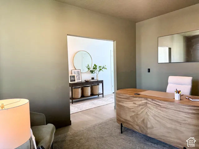 Smooth wall finish, recessed lighting, and a wide entryway