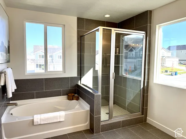 Built-in soaking tub with brushed nickel fixtures