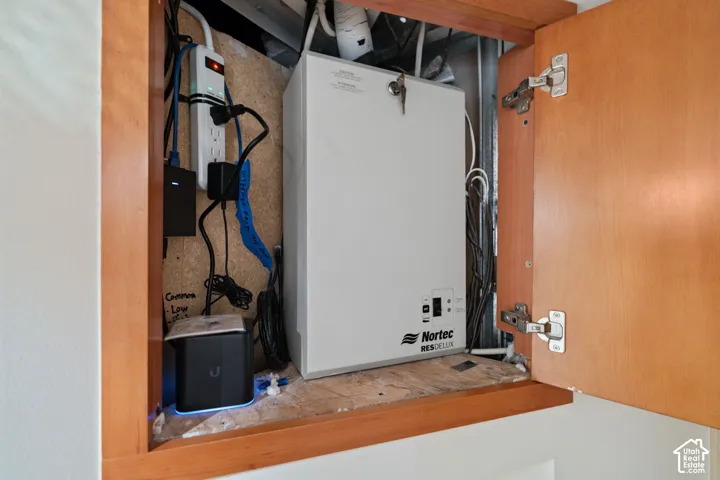 Built-in wooden cabinetry housing a dedicated humidifier unit and integrated telecommunications hardware