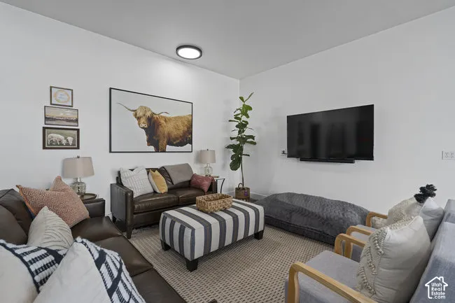 Carpeted flooring, white walls, and recessed ceiling lighting