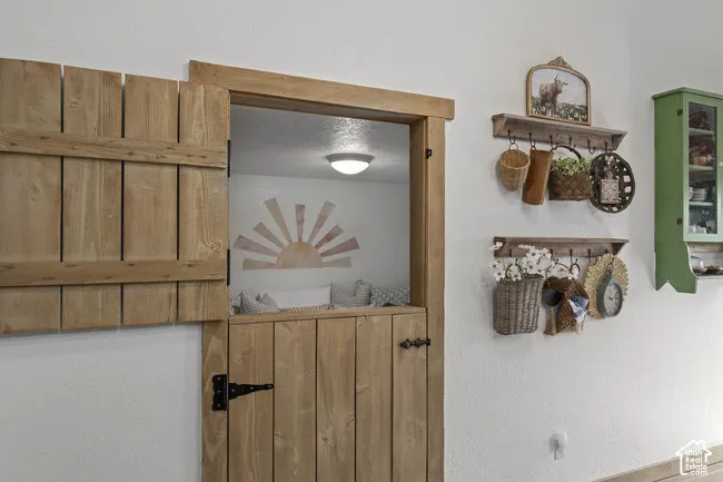 Custom wood-paneled Dutch door with black hardware