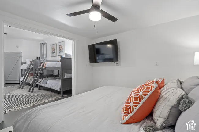 Integrated entertainment space with ceiling fan and wall-mounted television