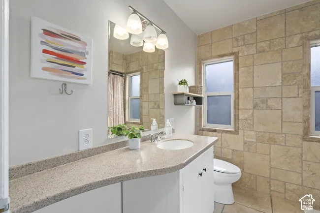 Vanity with an integrated sink and light-colored countertop