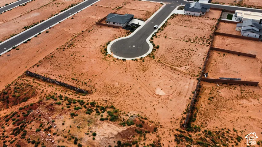 Vacant land parcel featuring a cul-de-sac location and retaining walls
