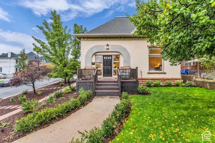 Exterior featuring a light-toned stucco fa
