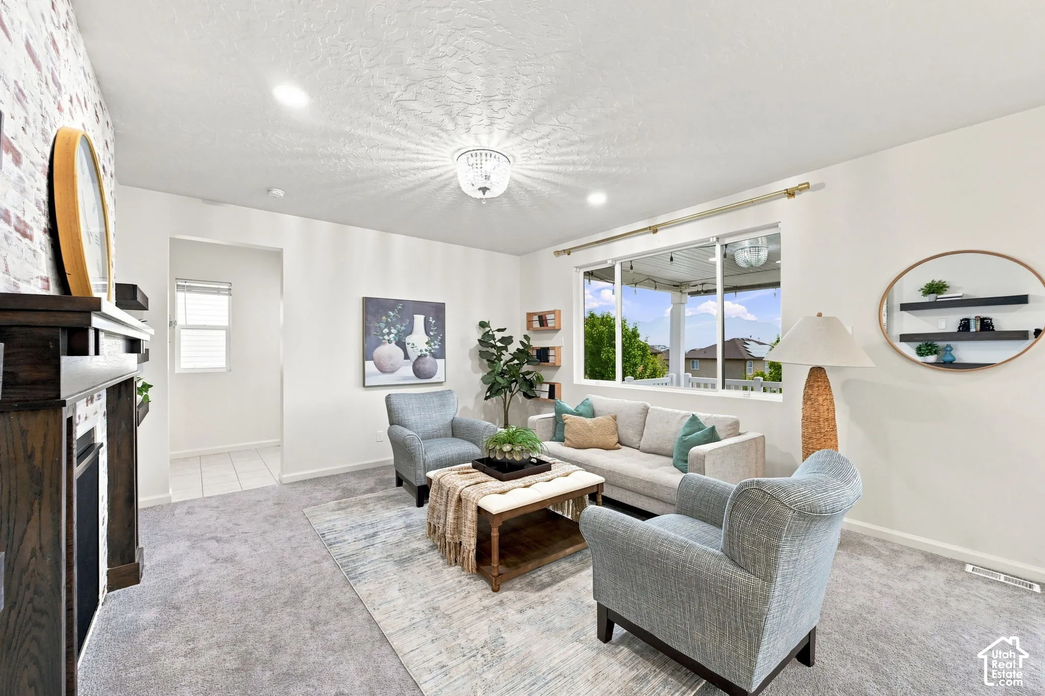 Living area featuring a fireplace with a textured brick-style surround, dark wood-finish mantel, recessed lighting, and a multi-light flush mount ceiling fixture